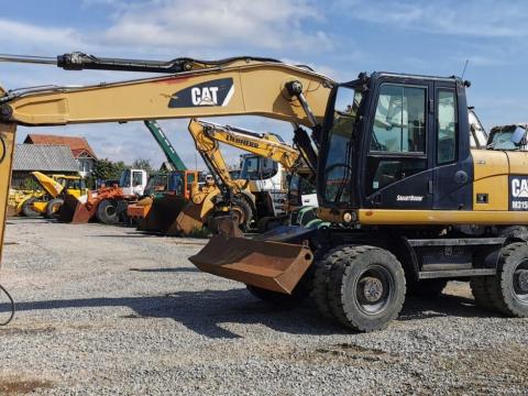 Caterpillar M315D gumikerekes kotró