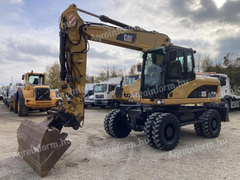 CAT Caterpillar M316D 17 t gumikerekes kotrógép klímával eladó