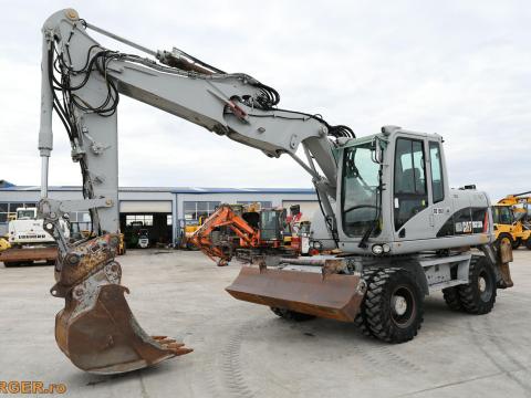 Caterpillar M313D gumikerekes kotró Caterpillar M313D gumikerekes kotró