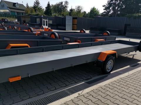 Új Orange hosszúanyag szállító utánfutó (130x600 cm) 750 Kg - Magyar termék Új Orange hosszúanyag szállító utánfutó (130x600 cm) 750 Kg - Magyar termék