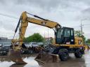 Caterpillar M313D gumikerekes kotró