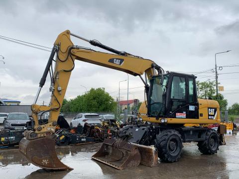 Caterpillar M313D gumikerekes kotró Caterpillar M313D gumikerekes kotró