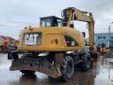Caterpillar M313D gumikerekes kotró