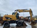 Caterpillar M313D gumikerekes kotró