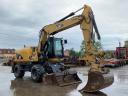 Caterpillar M313D gumikerekes kotró