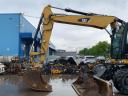 Caterpillar M313D gumikerekes kotró