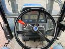 New Holland TS 115 homlokrakodóval