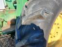 John Deere 710 traktor homlokrakodóval eladó