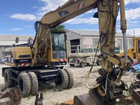 CAT M312 gumikerekes kotró eladó
