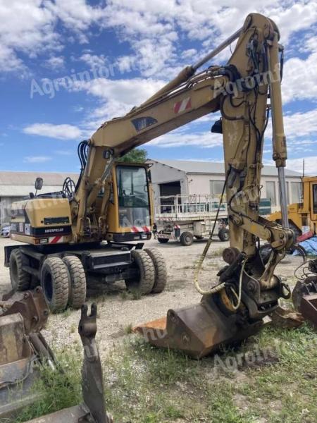 CAT M312 gumikerekes kotró eladó