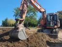 Eladó napi használatban lévő 2015-ös Doosan DX 160W-3 forgó kotró gumikerekes kivitelben