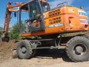 Eladó napi használatban lévő 2015-ös Doosan DX 160W-3 forgó kotró gumikerekes kivitelben
