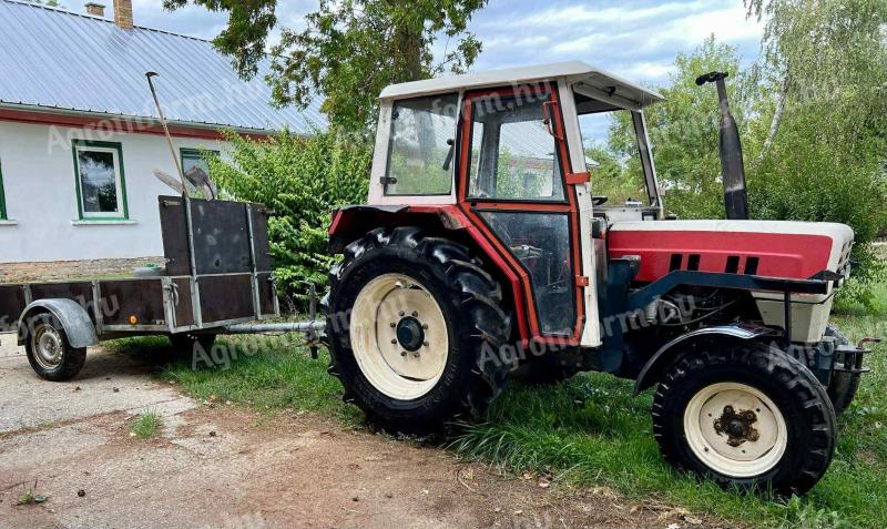 Steyr 8055 homlokrakodóval és utánfutóval eladó