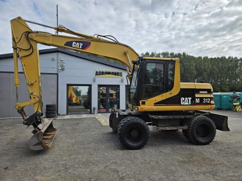 Caterpillar M312 gumikerekes forgókotró Caterpillar M312 gumikerekes forgókotró