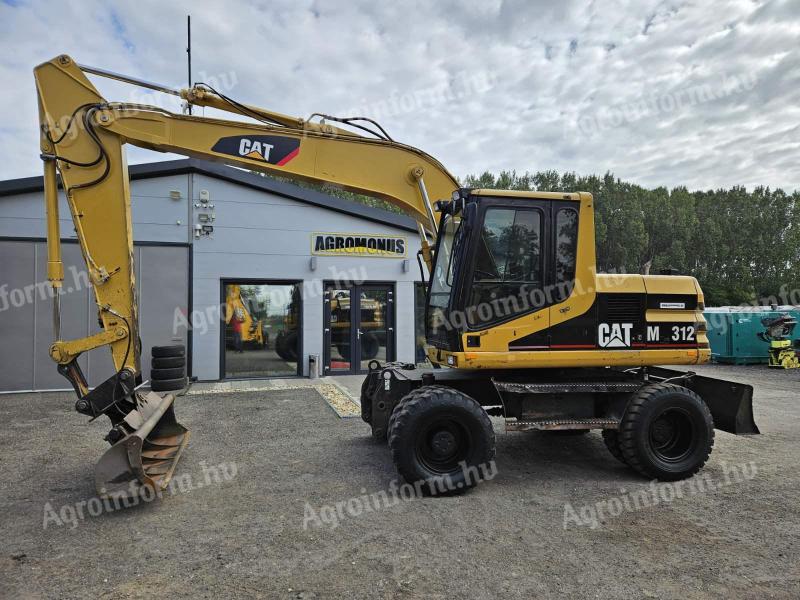 Caterpillar M312 gumikerekes forgókotró