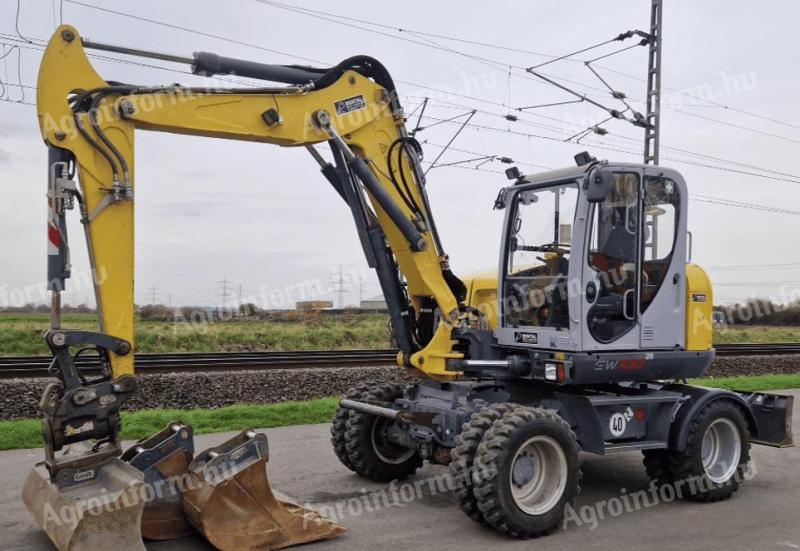 Gumikerekes kotrógép Wacker Neuson EW100 Powertilt rendszerrel eladó