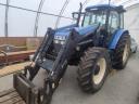 New Holland TM 120 homlokrakodóval