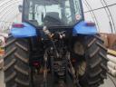 New Holland TM 120 homlokrakodóval