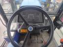 New Holland TM 120 homlokrakodóval