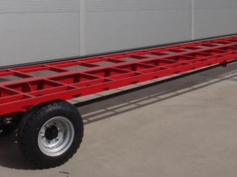 12m hosszú 4 kerék kormányzású pótkocsi telephelyen belüli áru mozgatáshoz,  5 tonna teherbírással