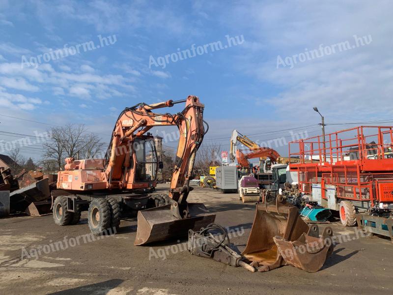 Atlas 1304 gumikerekes kotró