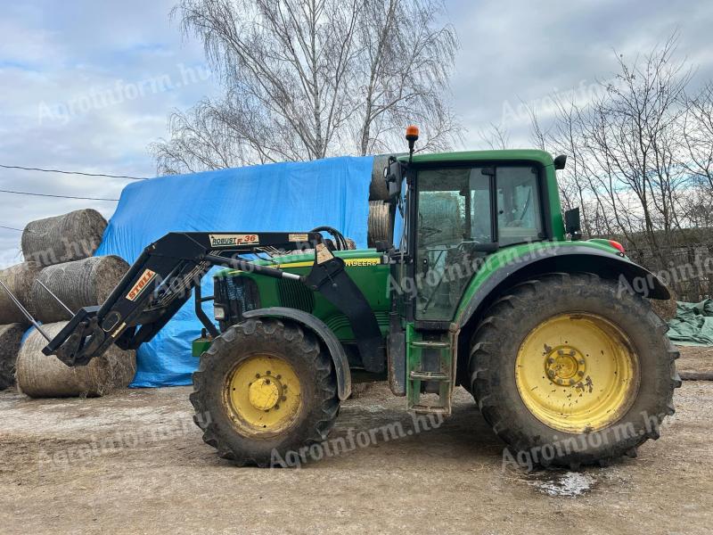 John Deere 6520 Premium eladó Stoll homlokrakodóval, rugózott híddal és fülkével
