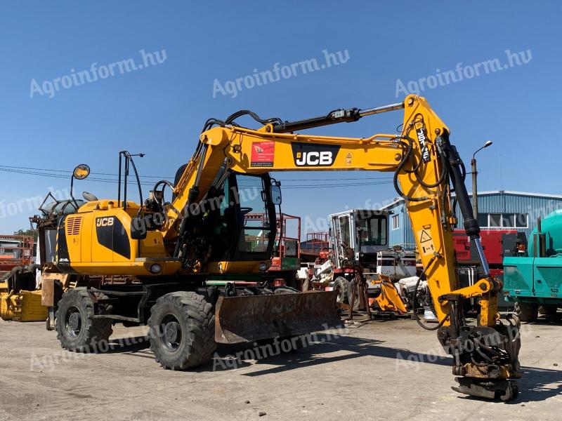 JCB JS145 + Engcon Rototilt gumikerekes kotró